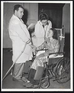 Affliction of polio doesn't discourage patients of Haynes Memorial Hospital, Allston, from engaging in fun and gaiety. Tomorrow night an all-patient variety show ill be presented in hospital cafeteria. Proceed will be donated to the March of Dimes. Examining Blanch Carey are "Drs." Bob Burke and Bob Baker, both of Quincy. Show is called "Louis-Ville Laffs" in honor of Dr. Louis Weinstein head hospital physycian.