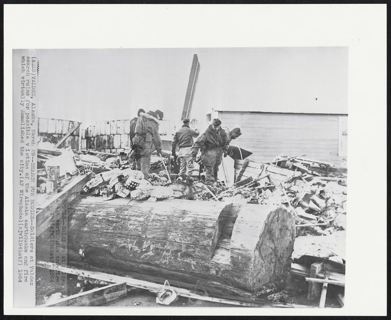 Search for Bodies -- Soldiers at Valdez search ruins for possible victims of the Alaska earthquake and fire which virtually demolished the city.