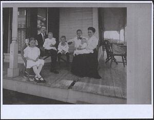 Dickinson and related families gathered on the porch at the Dickinson home on Dickinson Hill Road