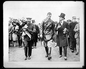 Charles Lindbergh walking with two other people