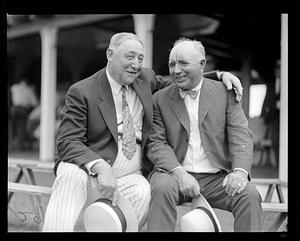 Two unidentified men smiling