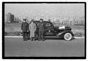 Policemen standing next to Boston Police Safety Education vehicle, Back Bay Fens