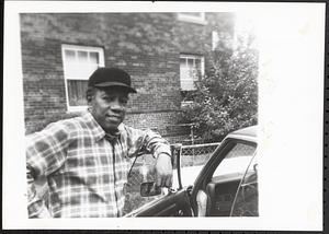 Man standing next to a car