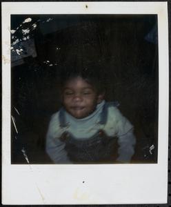 Child wearing overalls