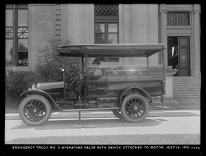 Distribution Department, Emergency Truck No. 2, operating valve with device attached to motor in front of Chestnut Hill Low Service Pumping Station, Brighton, Mass., Jul. 14, 1916