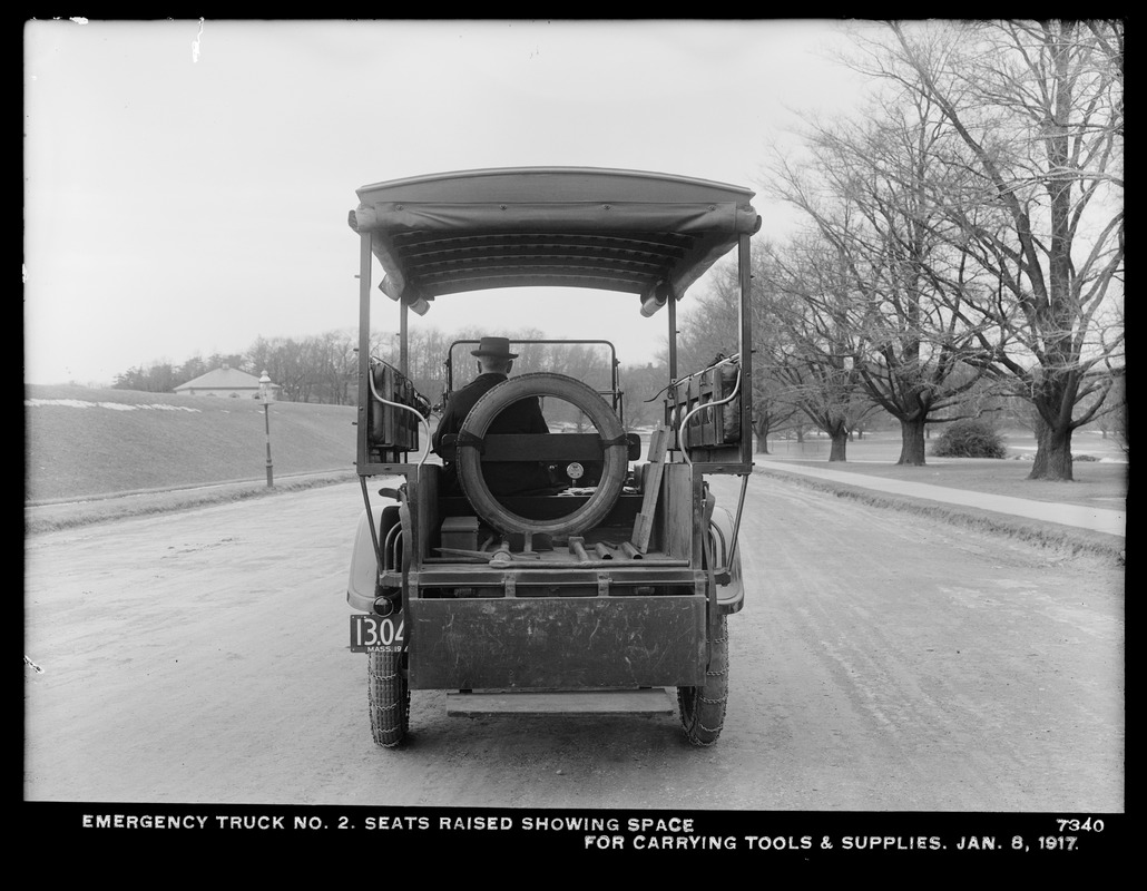 Distribution Department, Emergency Truck No. 2, seats raised showing space for carrying tools and supplies; in front of Chestnut Hill Low Service Pumping Station, Brighton, Mass., Jan. 8, 1917