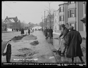 Distribution Department, Low Service Pipe Lines, condition of streets after break in 30-inch main, Boylston Street at Boylston Place, looking west, Brookline, Mass., Feb. 14, 1917