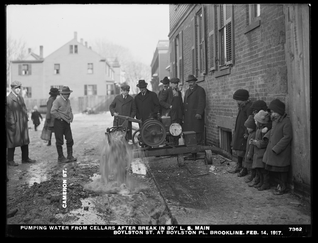 Distribution Department, Low Service Pipe Lines, pumping water from cellars after break in 30-inch main, Boylston Street at Boylston Place; Cameron Street, Brookline, Mass., Feb. 14, 1917