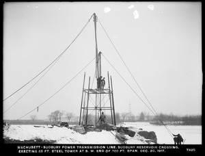 Wachusett Department, Wachusett-Sudbury power transmission line, Sudbury Reservoir crossing, erecting 68-foot steel tower at southwesterly end of 700-foot span, Southborough, Mass., Dec. 20, 1917