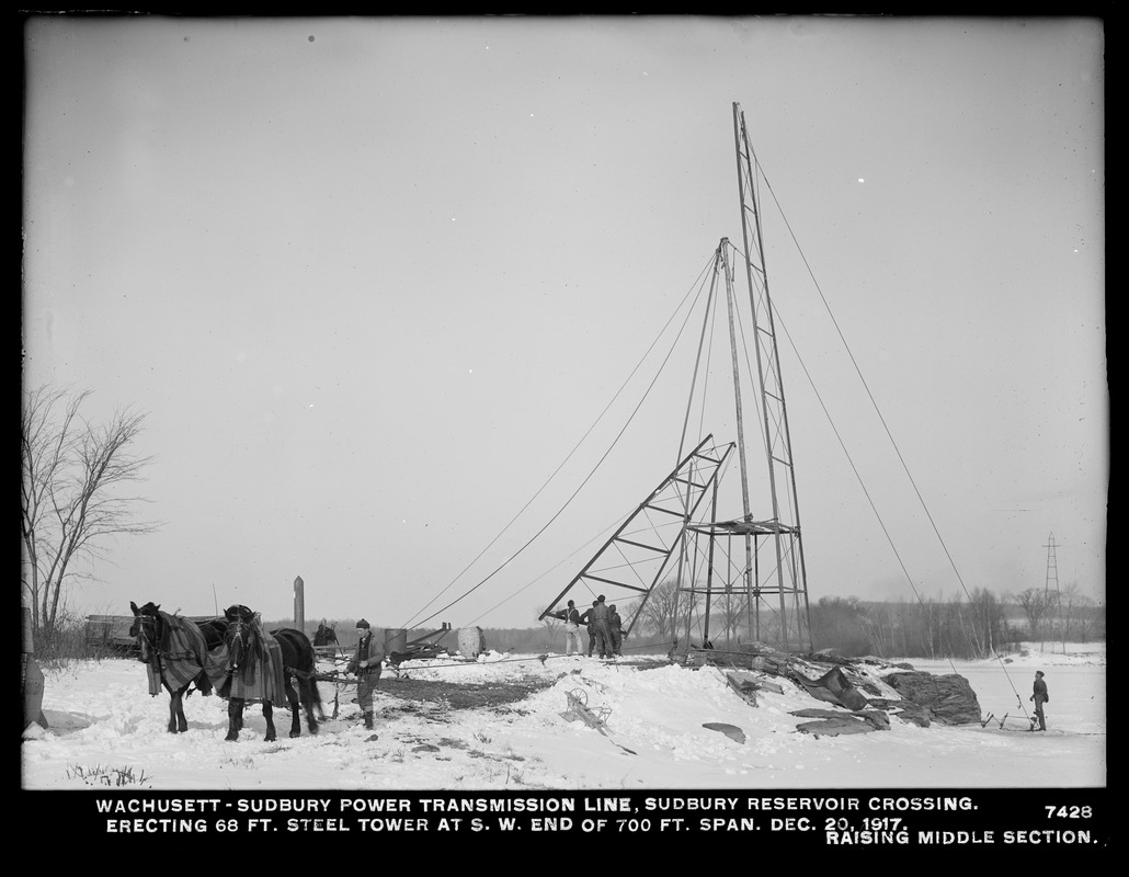 Wachusett Department, Wachusett-Sudbury power transmission line, Sudbury Reservoir crossing, erecting 68-foot steel tower at southwesterly end of 700-foot span, raising middle section, Southborough, Mass., Dec. 20, 1917