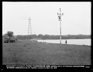 Wachusett Department, Wachusett-Sudbury power transmission line, unreeling and stringing conductors, Sudbury Reservoir 68-foot tower crossing, Southborough, Mass., May 29, 1918