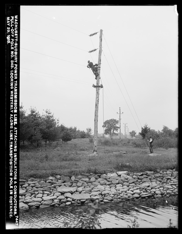 Wachusett Department, Wachusett-Sudbury power transmission line, attaching insulators and conductors, pull-off pole No. 343, looking westerly along line, transposition pole in distance, Southborough, Mass., May 29, 1918