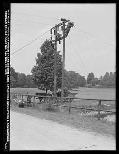 Wachusett Department, Wachusett-Sudbury power transmission line, attaching insulators and conductors, regular double pole No. 329, Southborough, Mass., May 28, 1918