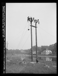 Wachusett Department, Wachusett-Sudbury power transmission line, attaching insulators and conductors, special double pole No. 328, Southborough, Mass., May 28, 1918
