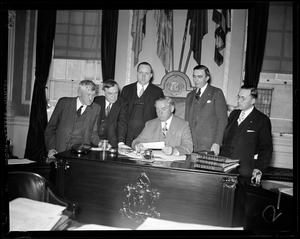 Governor Curley shown with Philip Russel, Daniel Coakley, Lt. Gov. Hurley, James J. Brennan, + W.C. Hennessey