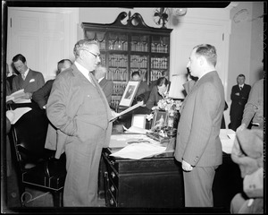 Swearing person in at his state house office