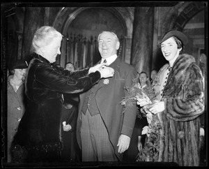 Receiving the Medal of Peace with daughter Mary looking on