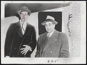 Surrenders to Senate Crime Committee Jurisdiction--Tony Accardo (right), reputed head of a national crime syndicate, stands with his lawyer, George Callahan (left), at U.S. Marshal’s office today. He surrendered and was served with a subpoena calling for his appearance before the Senate crime committee which has wanted to question Accardo after a witness disclose that Accardo and Jake Guzik were partners in gambling enterprise that netted them $278,667 in 1949. Guzik, another former associate of the late gang chief Al Capone, still is a fugitive from, a committee subpoena.