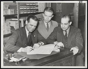 George Sisler, one of the greatest first baseman and batters history and recently voted into baseball's Hall of Fame, signs a five-year contract as high commissioner of the National Semi-Pro Baseball Congress. Left to right-George Sisler, Mickey McConnell, executive secretary, and Raymond Dumont, President of the National Semi-Pro Baseball Congress.