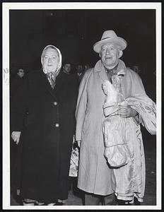 Home Again after a 20-hour train trip from Washington are Mr. and Mrs. Sam Rossman of Wolcott street, Lynn. They had been vacationing.