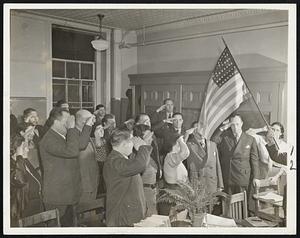 Immigrants Salute ‘Old Glory’. Refugees from the hatred and persecution of Europe, this group of immigrants salutes the flag that means freedom from oppression as they study for citizenship examinations in New York. Thousands have applied for admittance to the United States in recent weeks.