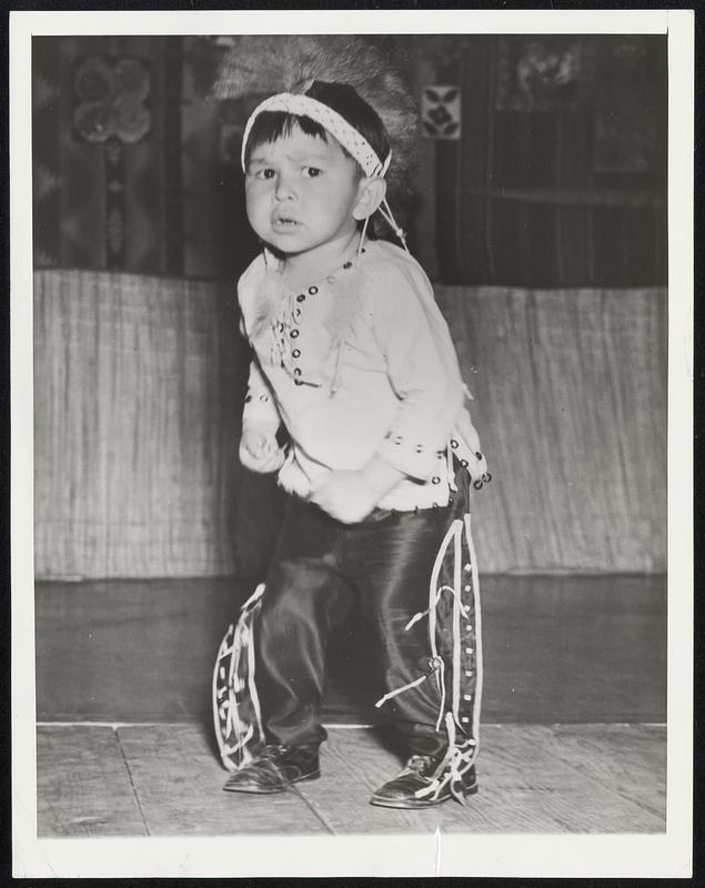 Buffalo's Comin' - Look Out! Freddie Lane, Jr., is a full-blooded Indian boy, only three years old but an accomplished dancer. He stole the show at the annual springtime celebration of the Muckleshoot Indian Tribe of western Washington with his buffalo dance. He paws the ground with his feet, snorts like two bidon in a raging battle.