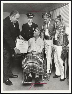 Joseph Addonizio of Winthrop, center, receives certificate making him an honorary member of the Navy League from A. William Rothermel, left, national director. Looking on, left to right, are Winthrop Police Lt. David Rice and two members of Pup Tent No. 42 of the V.F.W., Roy M. Jeffrey and Ernest Docette.