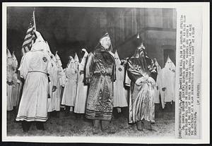 Says Blood Will Flow in Southern Streets- Dr. Samuel Green (center) Georgia Grand Dragon of the Ku Klux Klan says blood will flow in southern streets “if negroes are given a place at the side of white men through federal bayonets.” He made the statement at a klan demonstration here last night at a klan demonstration.