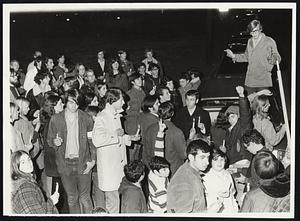 Brookline March front of Brookline High School -- Organizer -- standing on car is Ronnie Katz 17