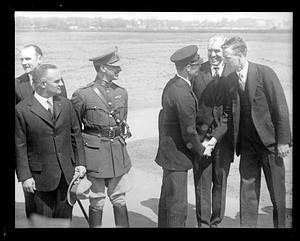 Charles Lindbergh shaking a man's hand