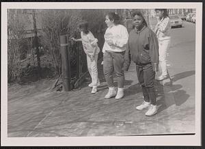 Group of four on the sidewalk