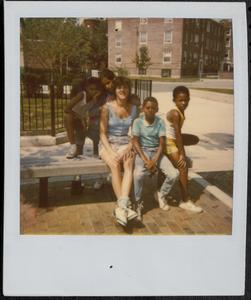 Group of friends on a bench in Newtowne Court