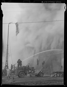 Truck and tower fighting fire
