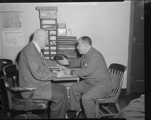 Two men in Herald offices