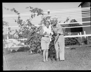 Unidentified couple with dog