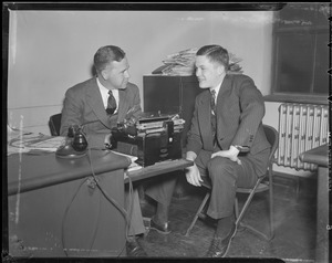 Possibly reporter at desk