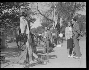 People looking at diving suit