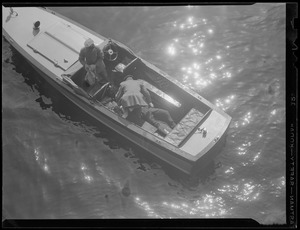 Men in a motorboat - Charles River? Locks?