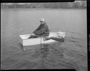 Men launch tiny row boat, Charles River