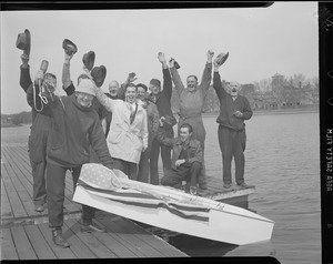 Men launch tiny row boat, Charles River