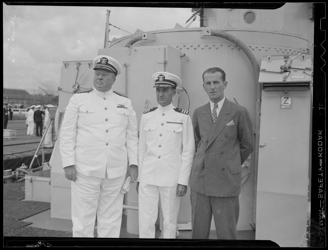 Officers and civilian aboard ship