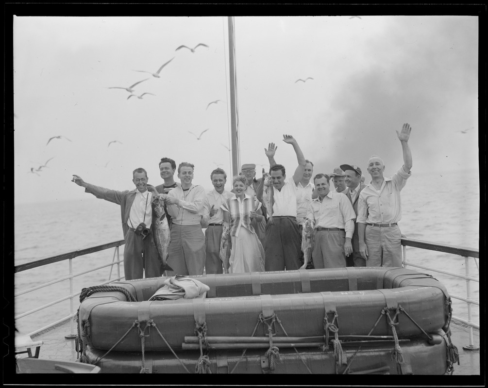 People waving on dock of boat