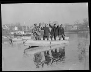 Four men in dinghy