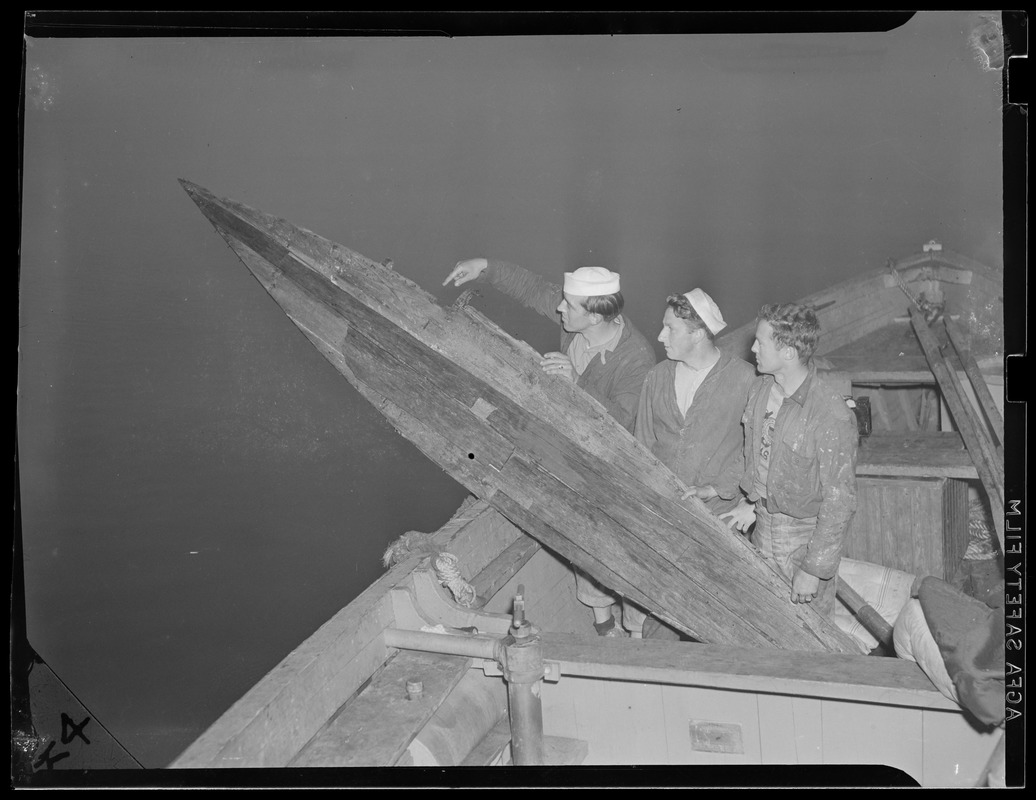 Sailors examine old skiff