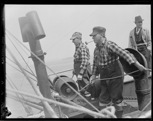 Men working aboard ship