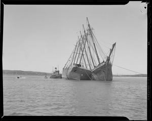 Old schooners "Harry C. Deering" and "Helen Barnet" attended by tug "Thor"