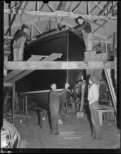 Working on new boat, Reid's Boatyard, Winthrop (Bill Soper, top left, Gus Tilley, bottom left, Jordon Pelley, top right, Unidentified Reid boy, bottom right)