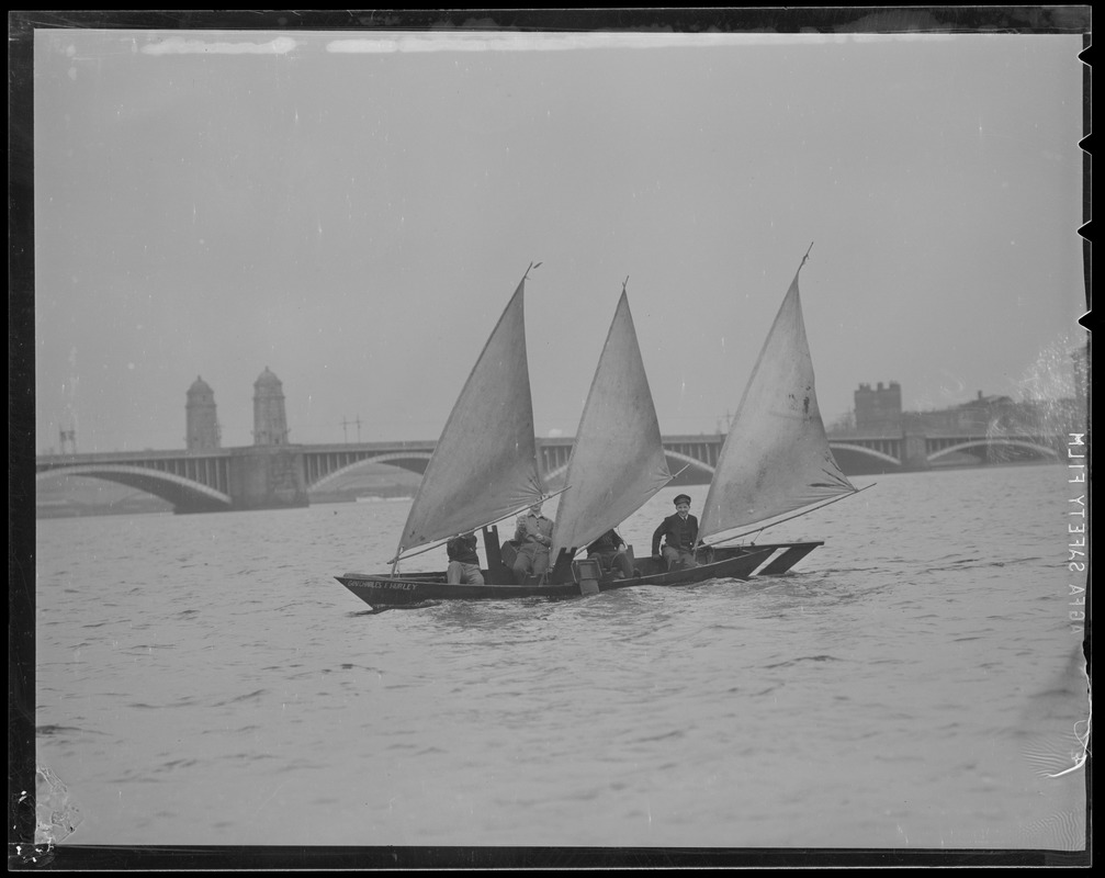 College students sail strange three-masted boat "Gov. Charles F. Hurley" on Charles River