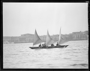 College students sail strange three-masted boat "Gov. Charles F. Hurley" on Charles River