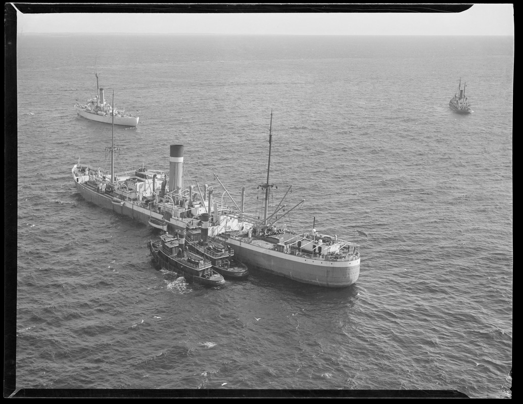 "City of Salisbury" guided by tugs (airplane view)